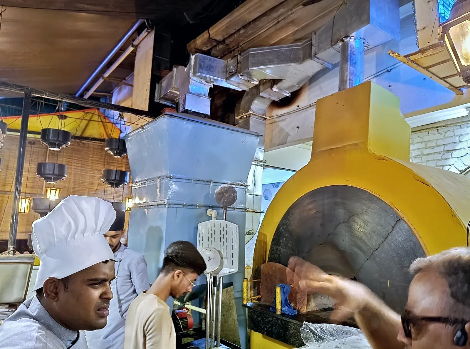 SuVayu-Bake unit installed above a wood-fired pizza oven