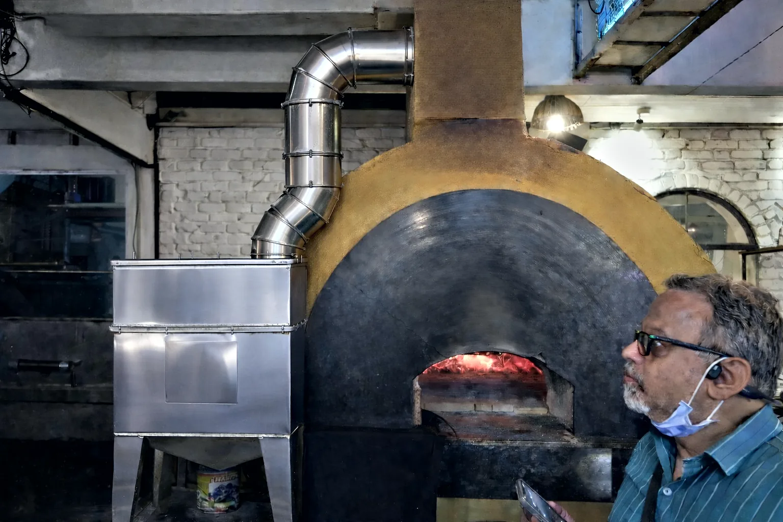 SuVayu-Bake prototype unit beside a wood-fired oven