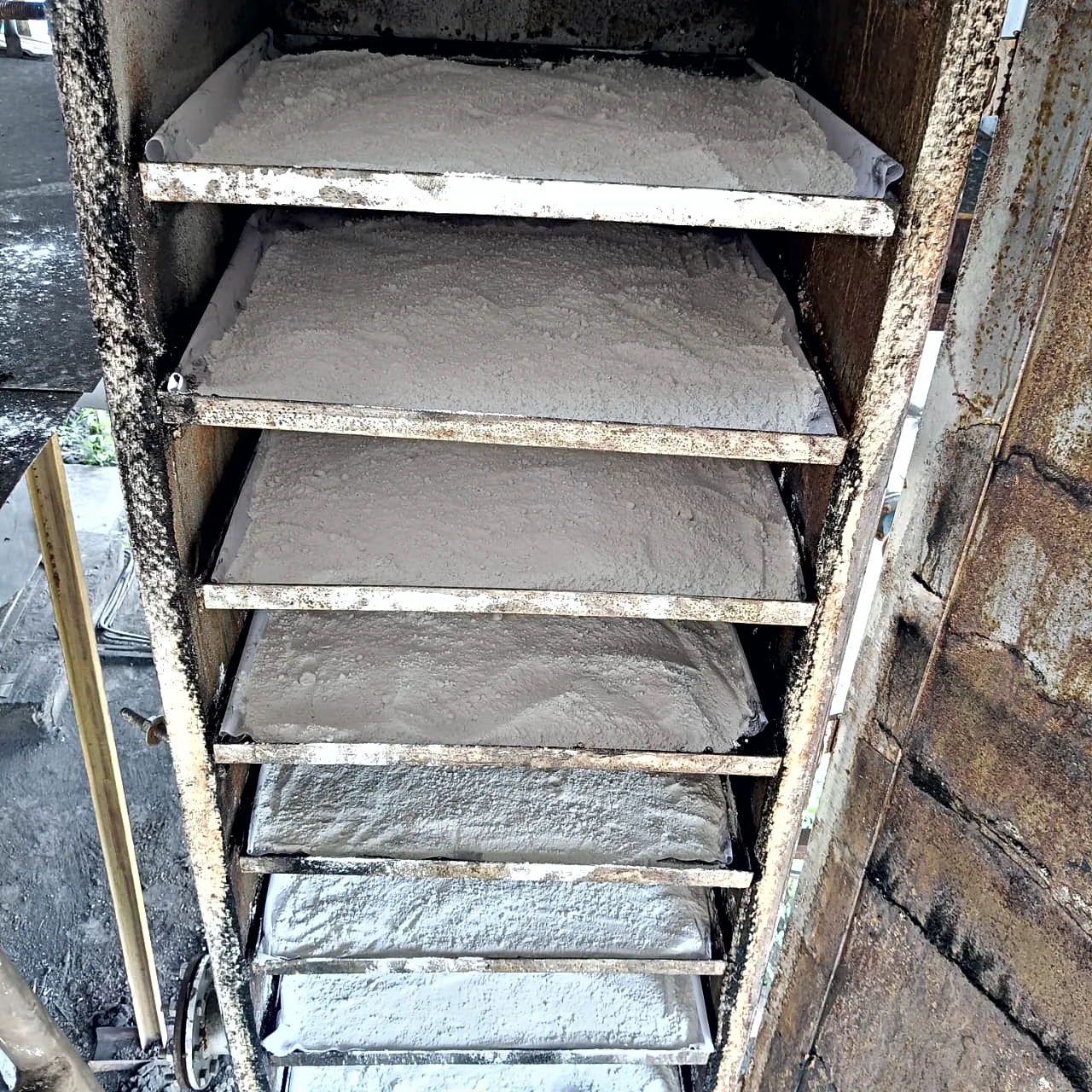 Trays of white adsorbent powder inside a Pureva tower